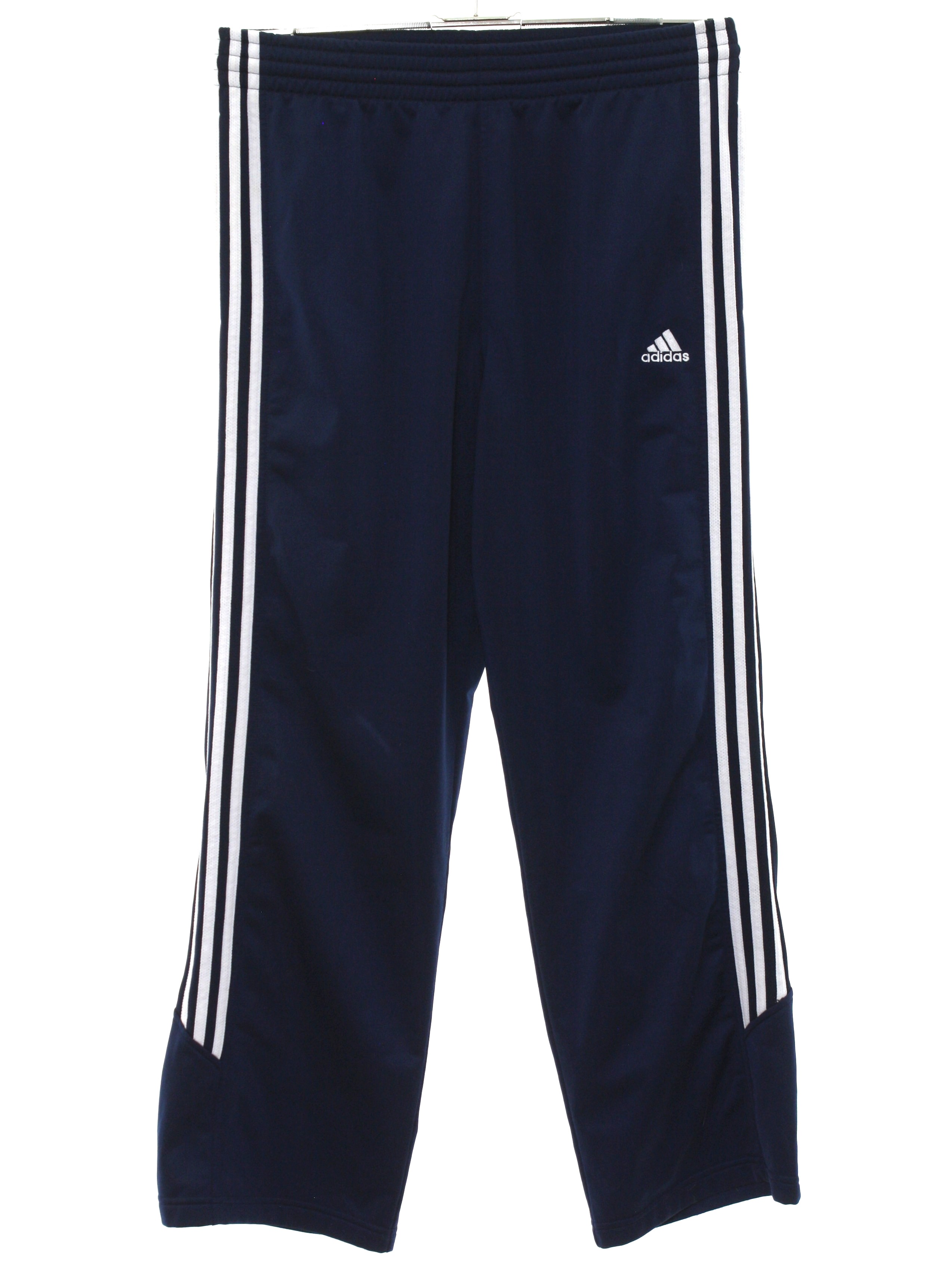 Pants: 90s -Adidas- Mens dark blue background polyester Straight leg, baggy  track pants with single snap plain cuff hem. No pockets, elastic waistline,  inside drawstrings, no belt loops. Sides of legs have