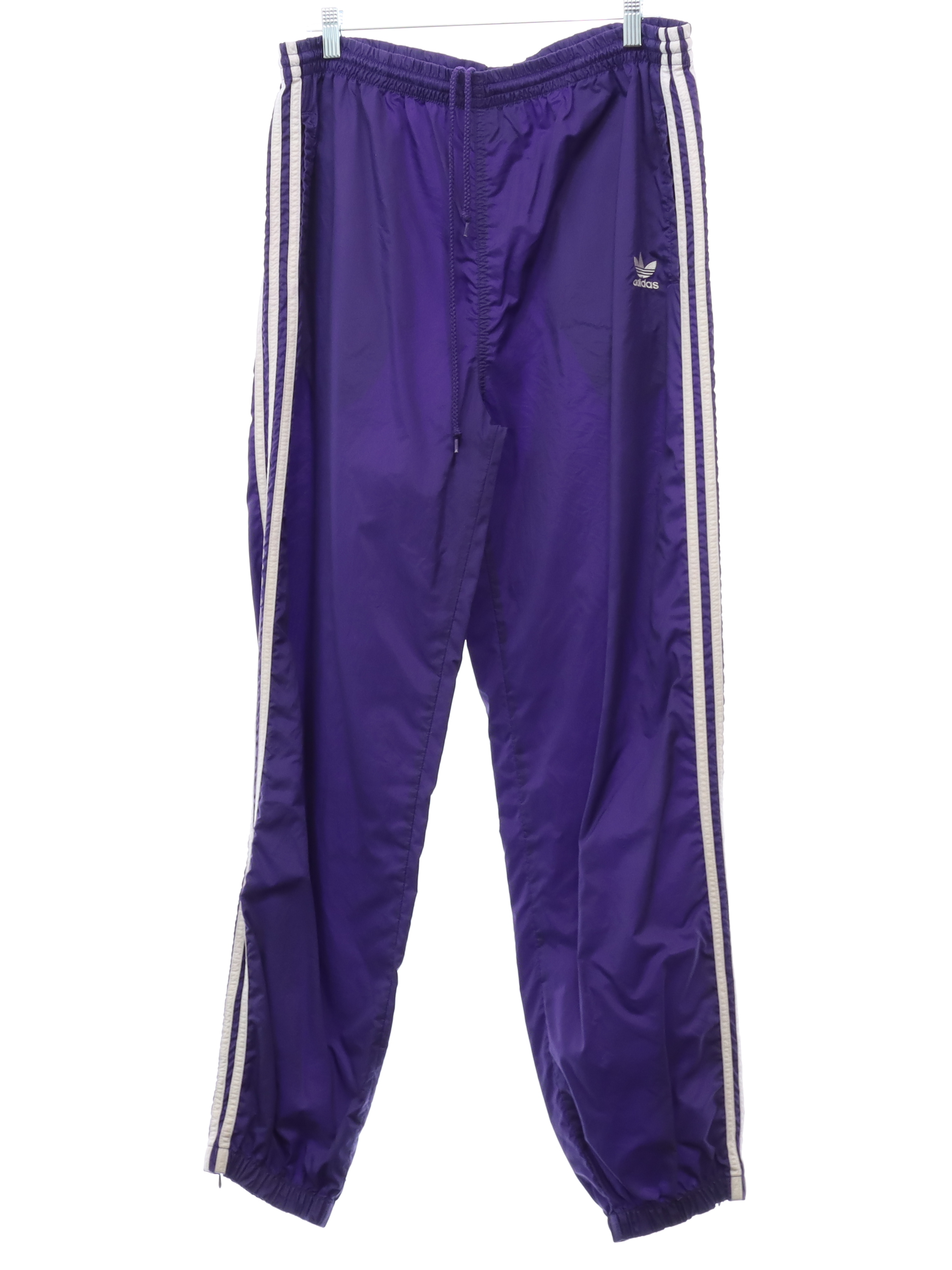 90's Vintage Pants: Late 90s -Adidas- Mens purple solid colored nylon shell  flat front track or jogging pants with elastic cuff hem with ankle zipper,  vertical seam inset side entry front pockets