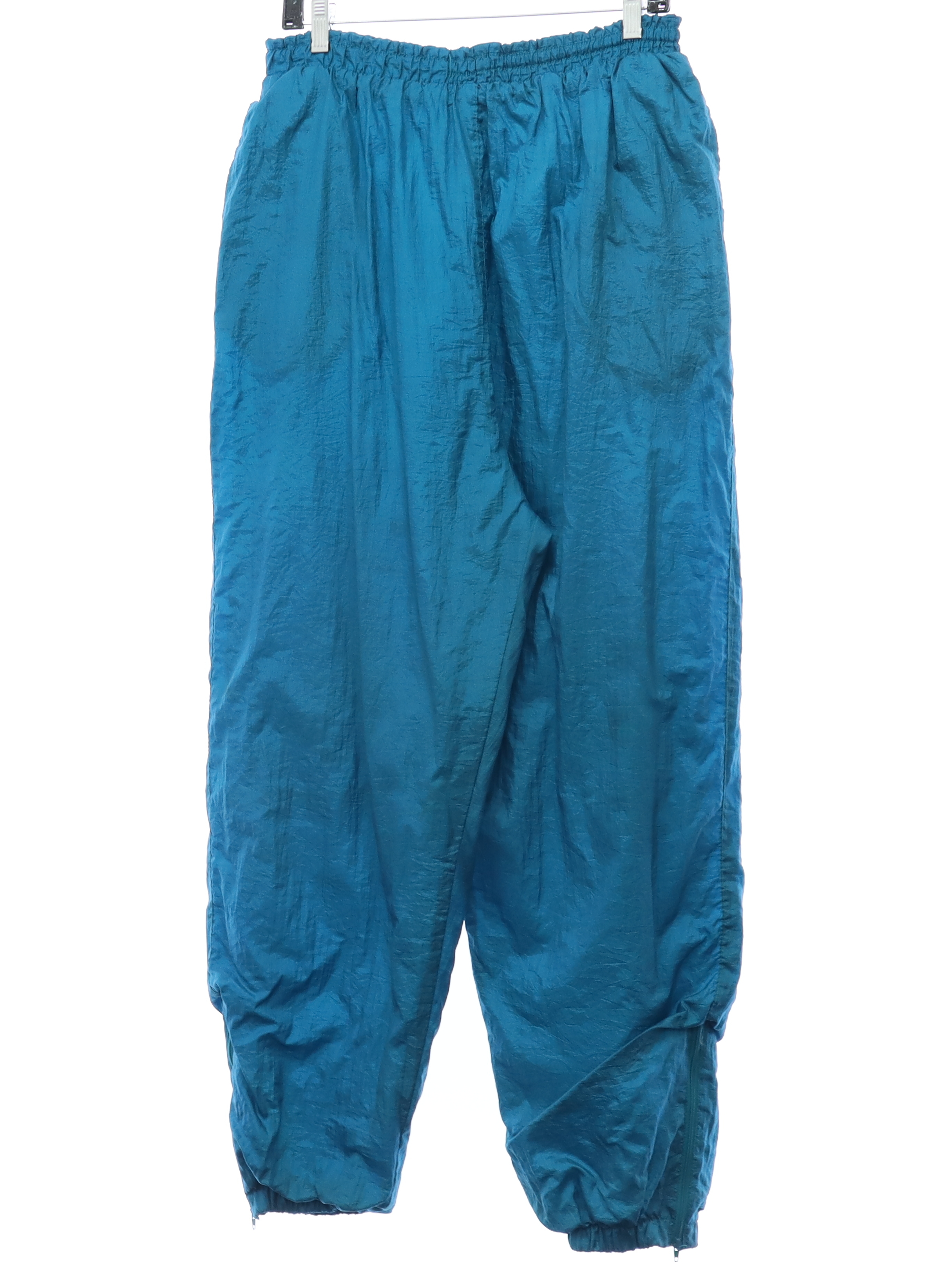 Retro 80s Pants (Basic Editions) : 80s style (made in 90s) -Basic Editions-  Womens teal-blue crinkled nylon shell track pants. Elastic pull on  waistband with front inside drawstring ties, inset side pockets