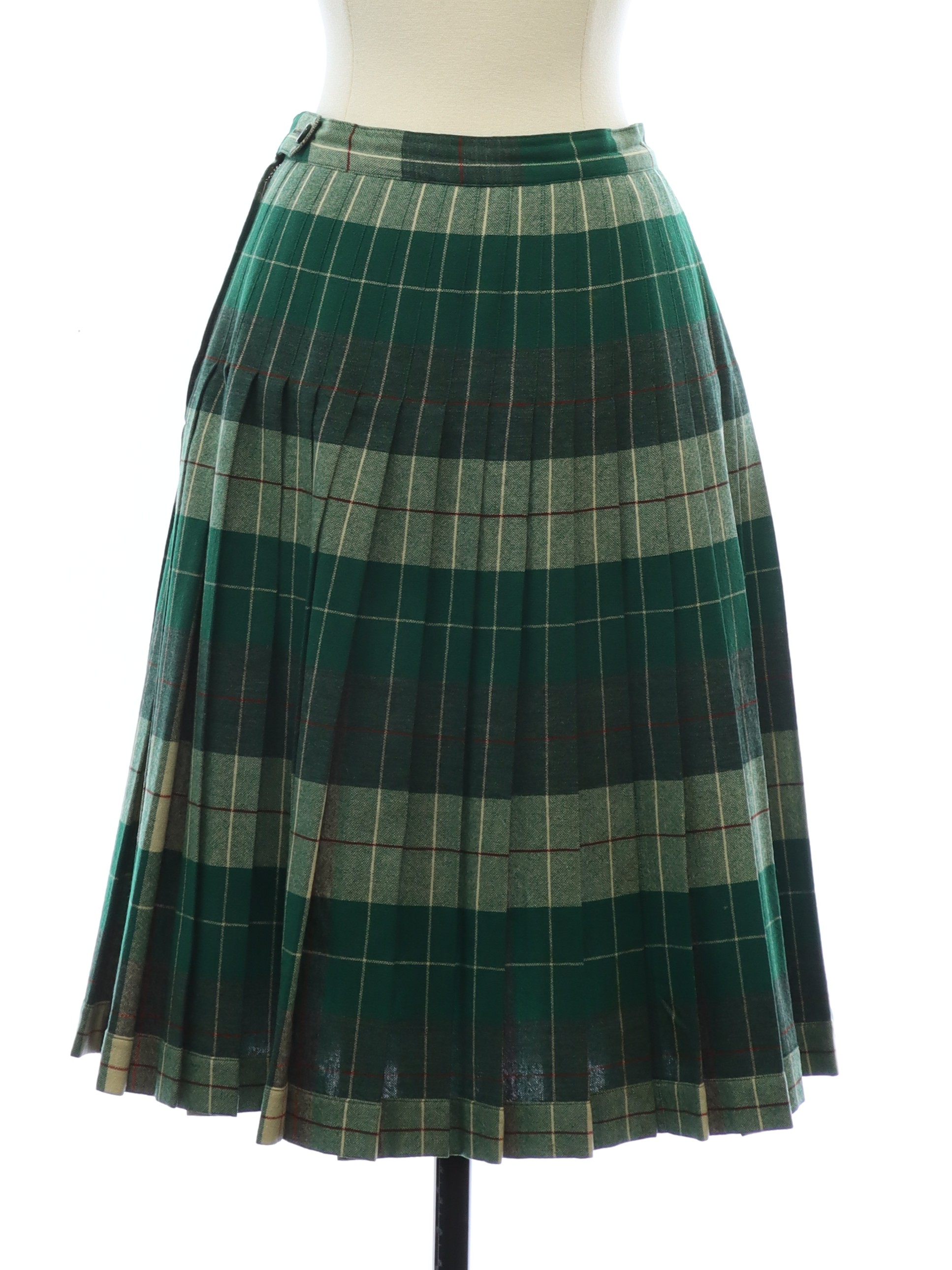 Sixties Vintage Plaid Skirt Early 60s Pendleton Womens wool pleated circle skirt that is stitched 7inches from the waistband with open pleats below. There is a button on the band with a